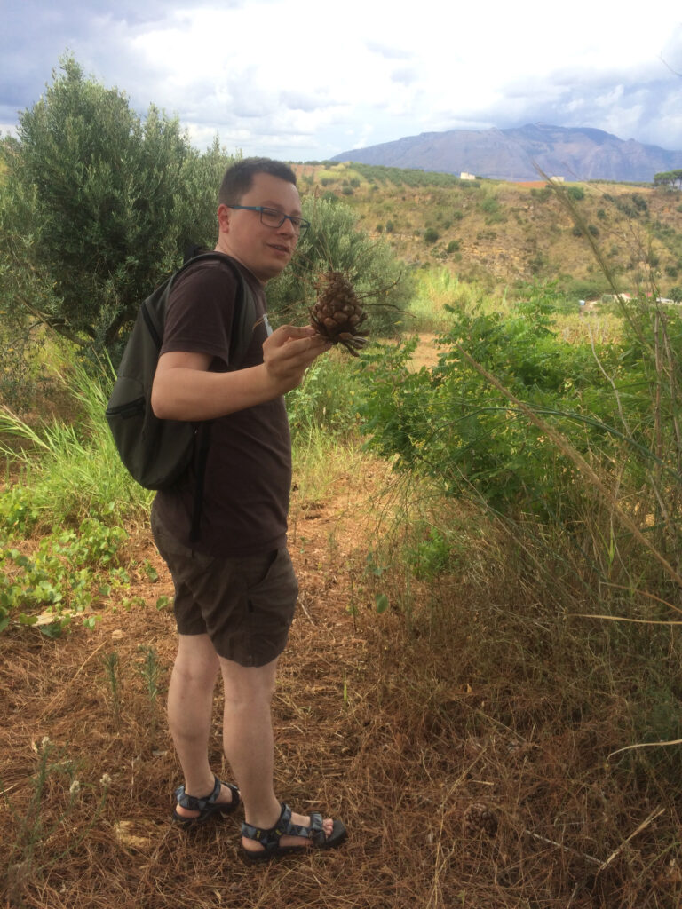 Szymon The Explorer with a pine cone at Partinico