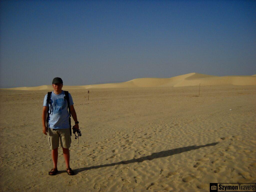 In the middle of the Sahara in the background the road to Algeria