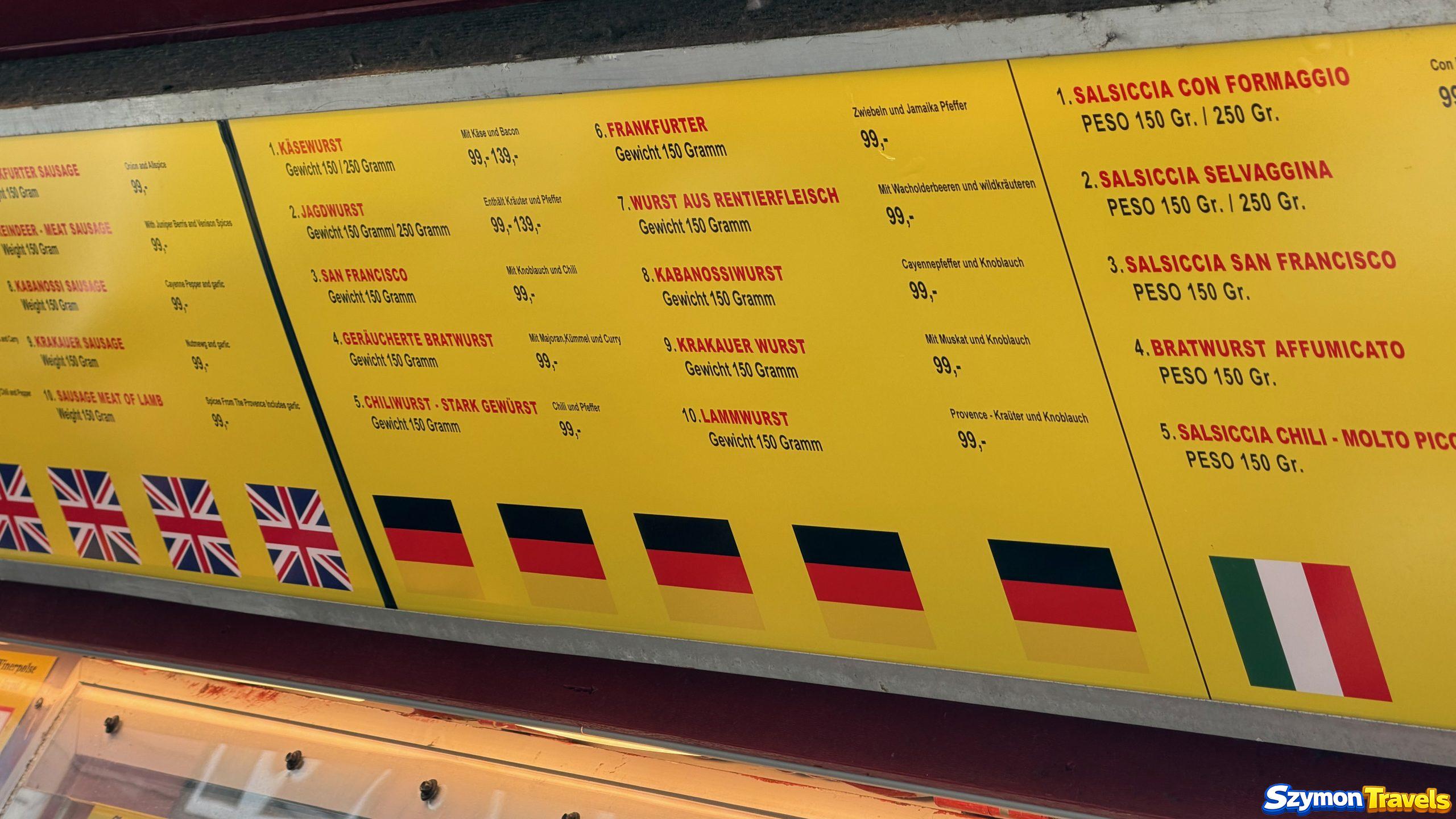 Menu Trekroneren w Bergen – ceny hot dogów 2026 Menu kiosku Trekroneren w Bergen z hot dogami za 99 NOK (około 39 PLN), w tym kiełbasą z renifera i Krakauer Wurst
